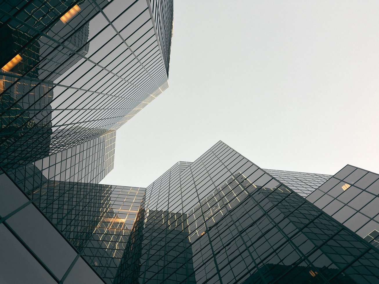 low angle view of skyscrapers looking up at the sky